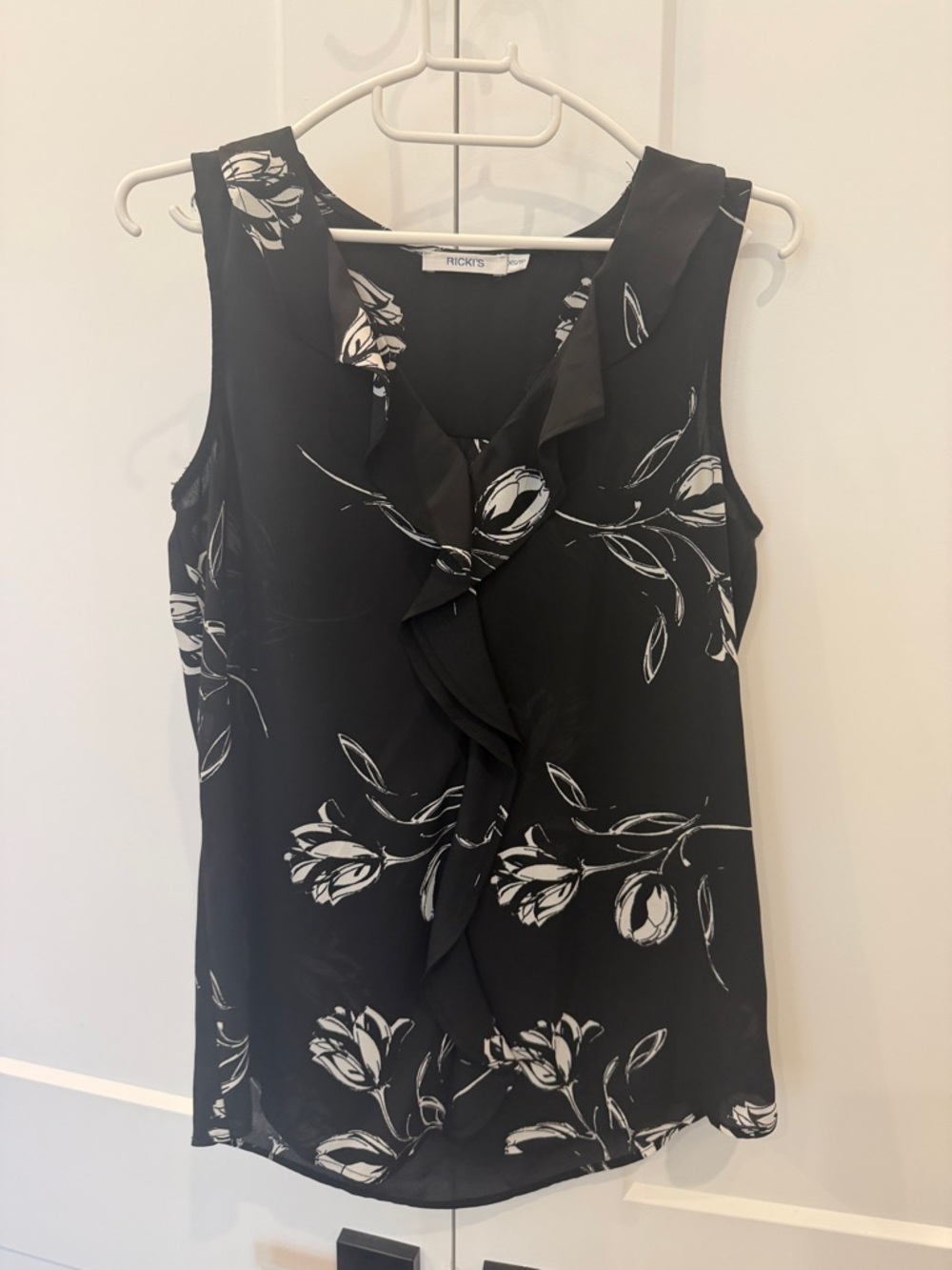 Ricki's Black & White Floral Ruffle Front Sleeveless Top